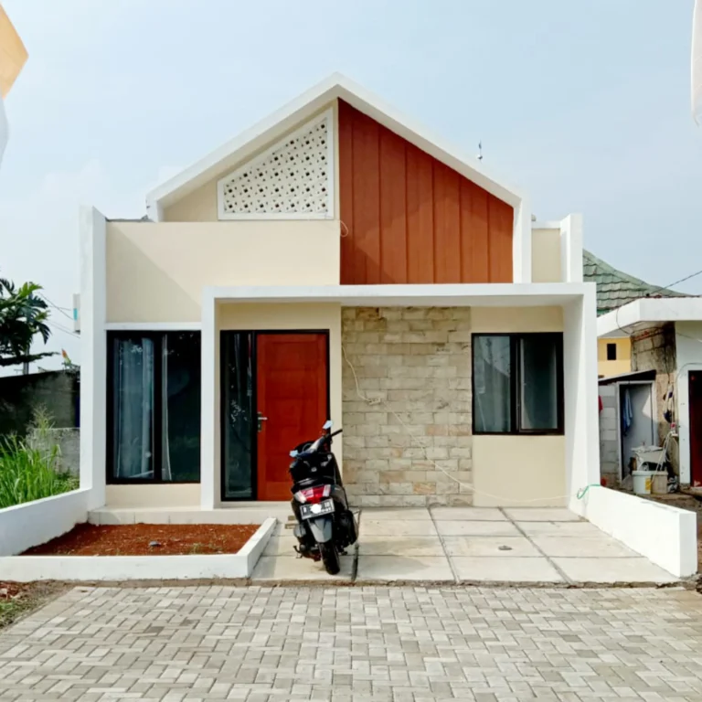 Tampak depan rumah Nandita Dramaga Bogor dengan desain modern minimalis, carport luas, dan fasad elegan.